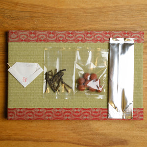 A set of tea for new year luck includes edible gold flakes, kombu, umeboshi plums, and Japanese tea