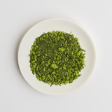 Japanese Organic Matcha Covered Genmaicha Loose Leaf Green Tea on a white plate