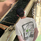 Man wearing Mizuba Matcha tshirt looking at loose leaf tea production in Japan
