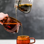 KINTO tea collection with tea pot, sepia pitcher, and glass tea cup - photo by Mizuba Tea Co.