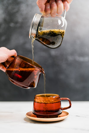 KINTO tea collection with tea pot, sepia pitcher, and glass tea cup
