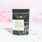 Sakura Sencha loose leaf tea with whole cherry blossoms by Mizuba Tea Co
