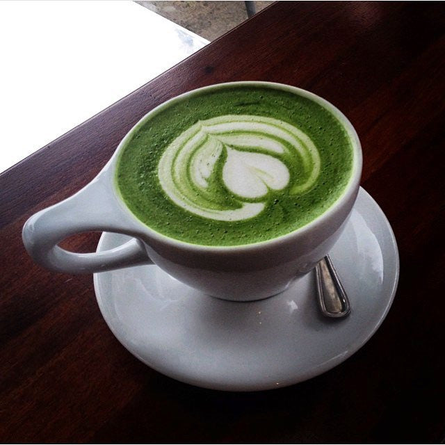 Matcha latte in a cafe cup