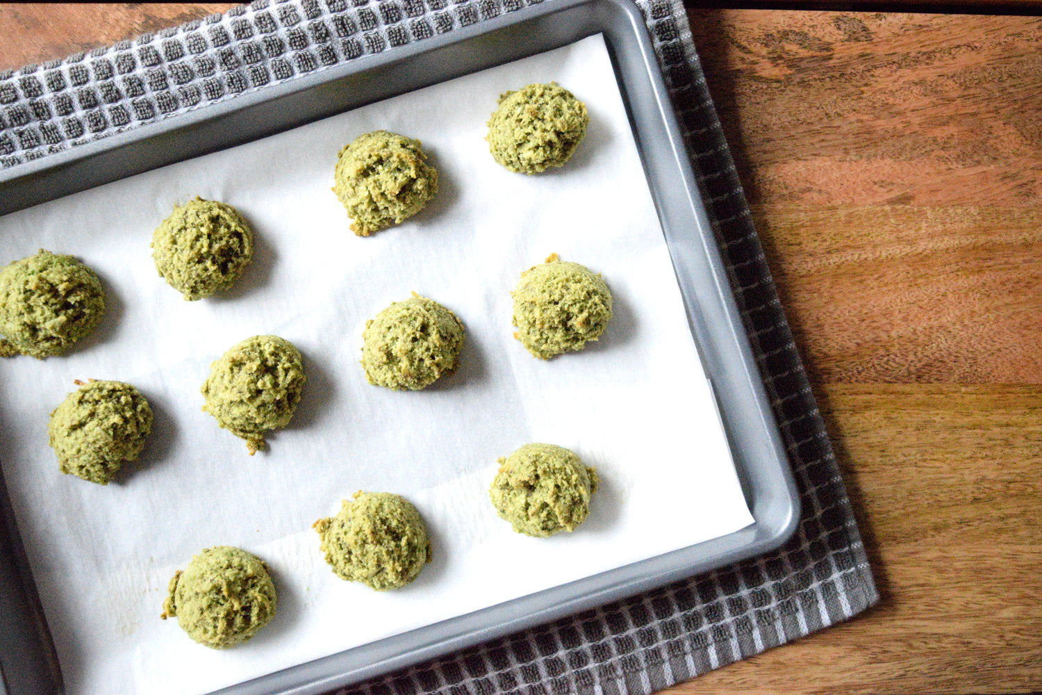 matcha green tea macaroons on a sheet pan