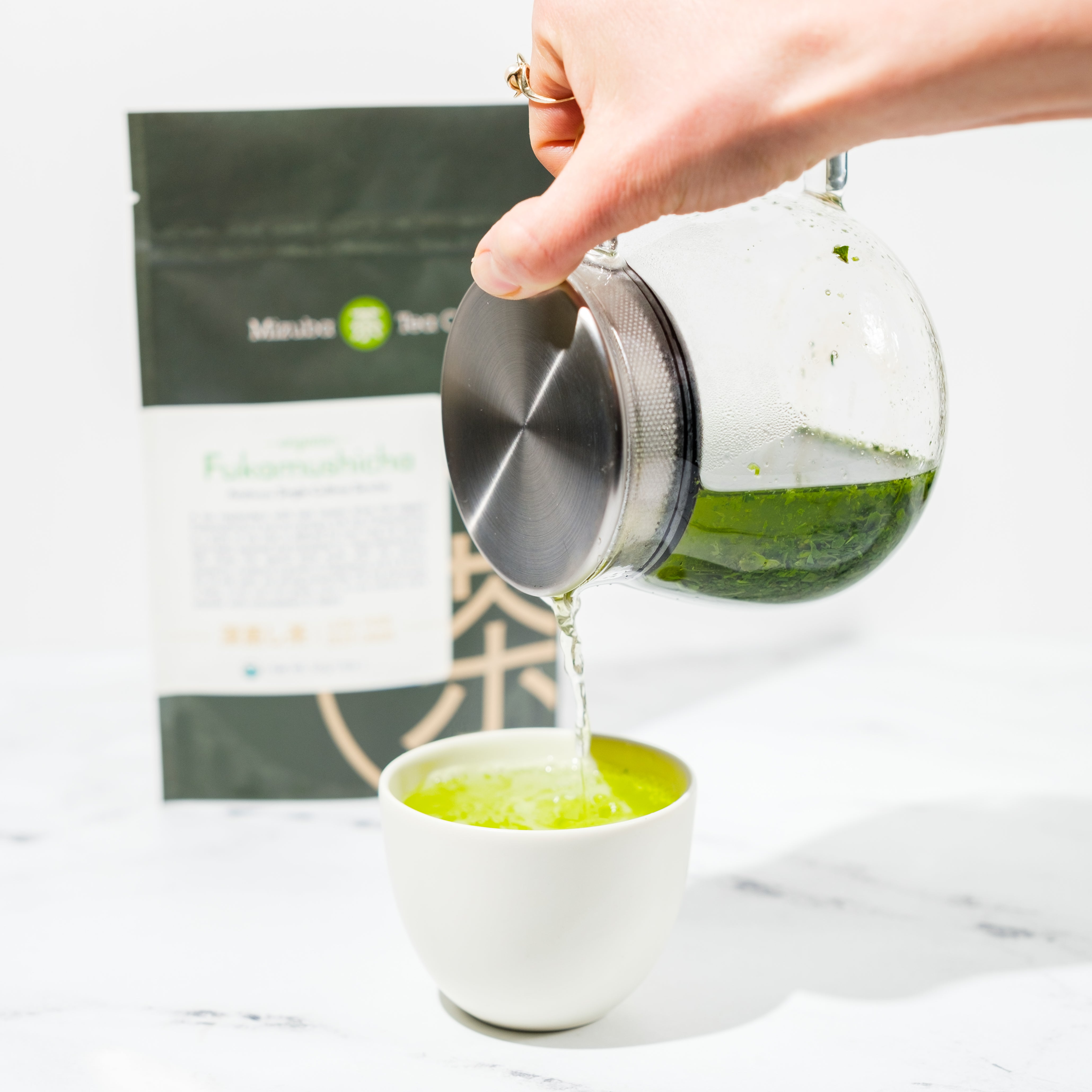 Organic Fukamushicha Asatsuyu being poured into cup