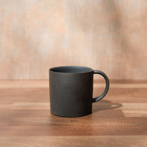Black unglazed tea cup by Nankei Pottery