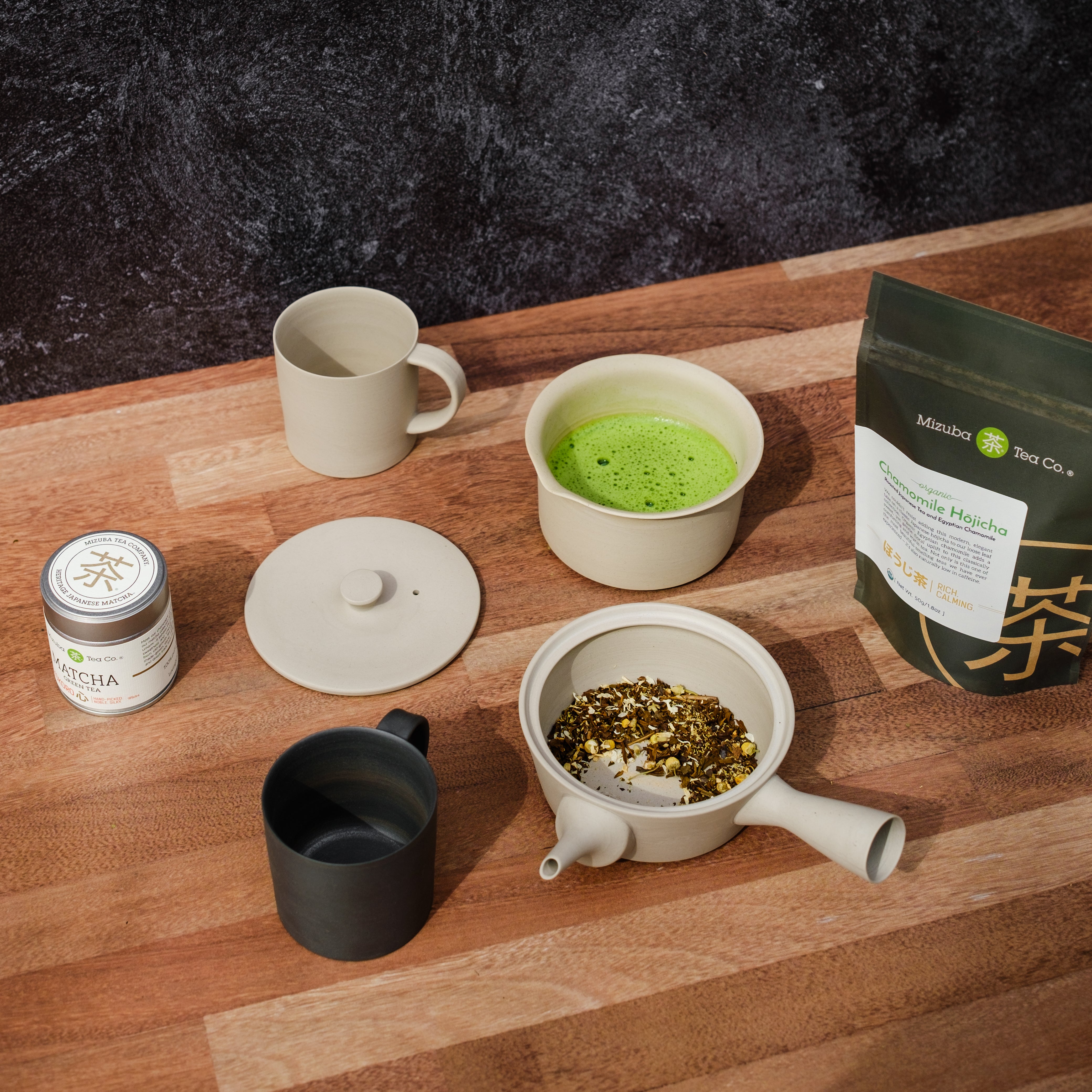 An assortment of Japanese tea items featuring ceramics, matcha, and loose leaf tea - Mizuba Tea Co.