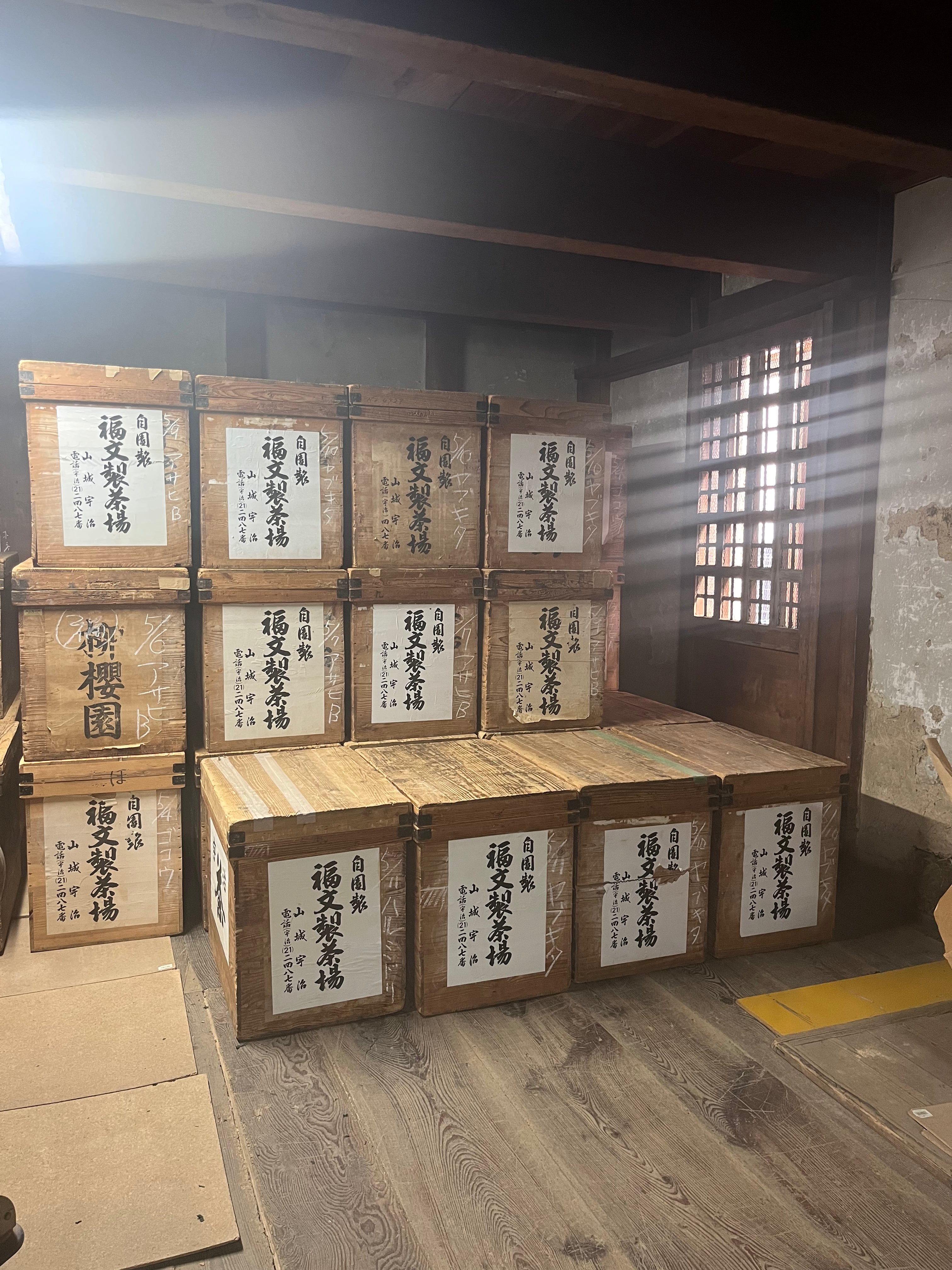 Uji tencha boxes stacked in a factory - Mizuba Tea Co.