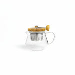 Hario glass and olive wood tea pot with built-in metal strainer for loose leaf tea. 