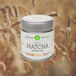 A tin of ceremonial Mizuba Matcha Green Tea superimposed on a video of nature scenes